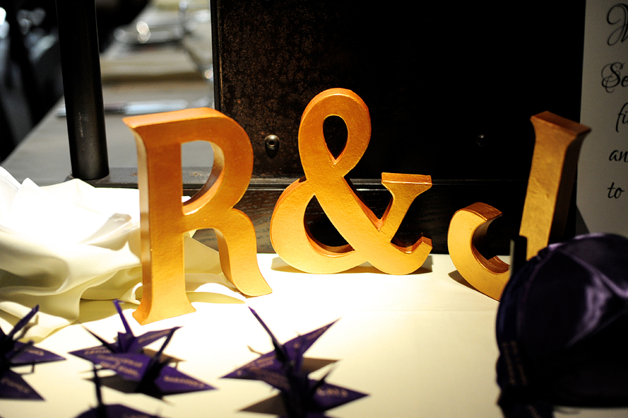 large gold initials and origami place cards