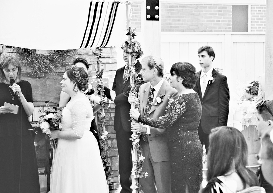 family holding the chuppah at a cambridge jewish wedding